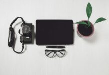 Best Side Gigs To Make Extra Money in 2026 camera beside laptop