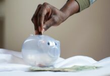 10 Insanely Smart Ways To Save Money Fast person putting coin in a piggy bank ways to save money fast